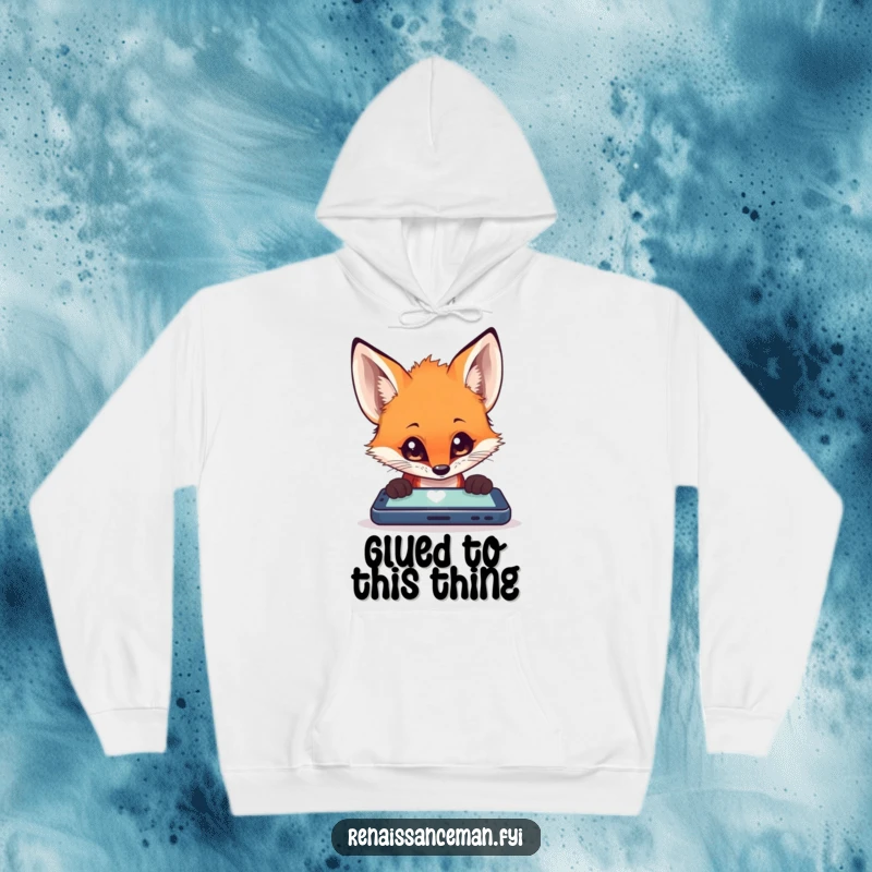 Funny fox with wide, curious eyes deeply engrossed in a bright mobile device, featured on a soft, warm hoodie.