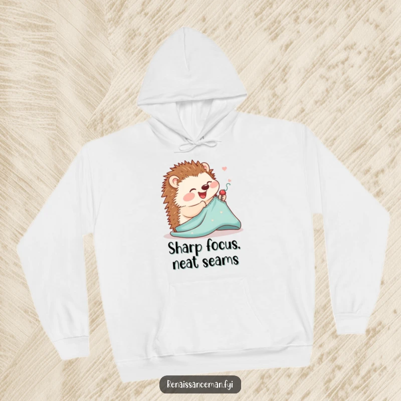 Funny hoodie featuring a joyful hedgehog concentrating on delicately pinning a sewing pattern to fabric, radiating cuteness.